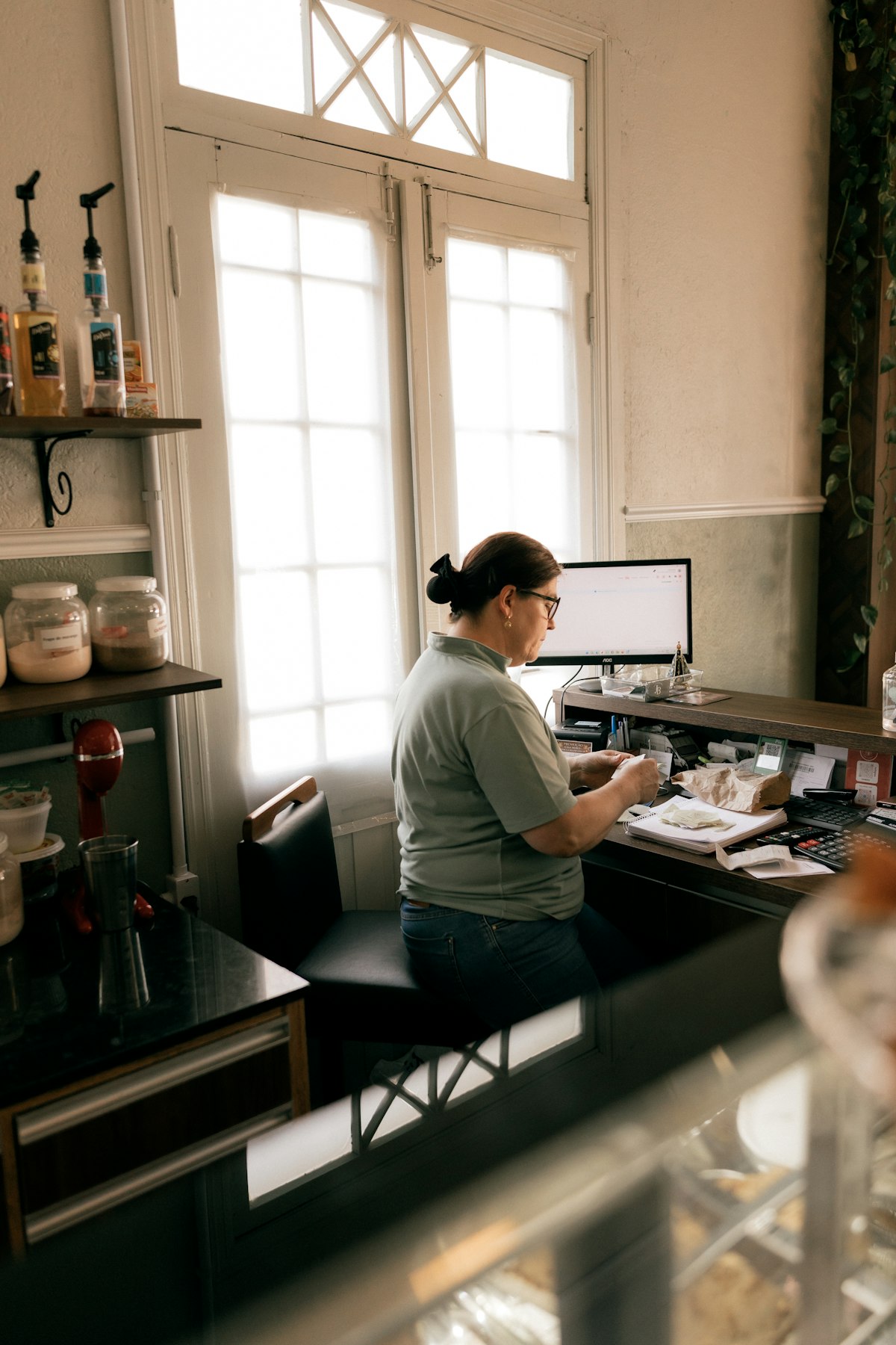 A small business owner working in her shop